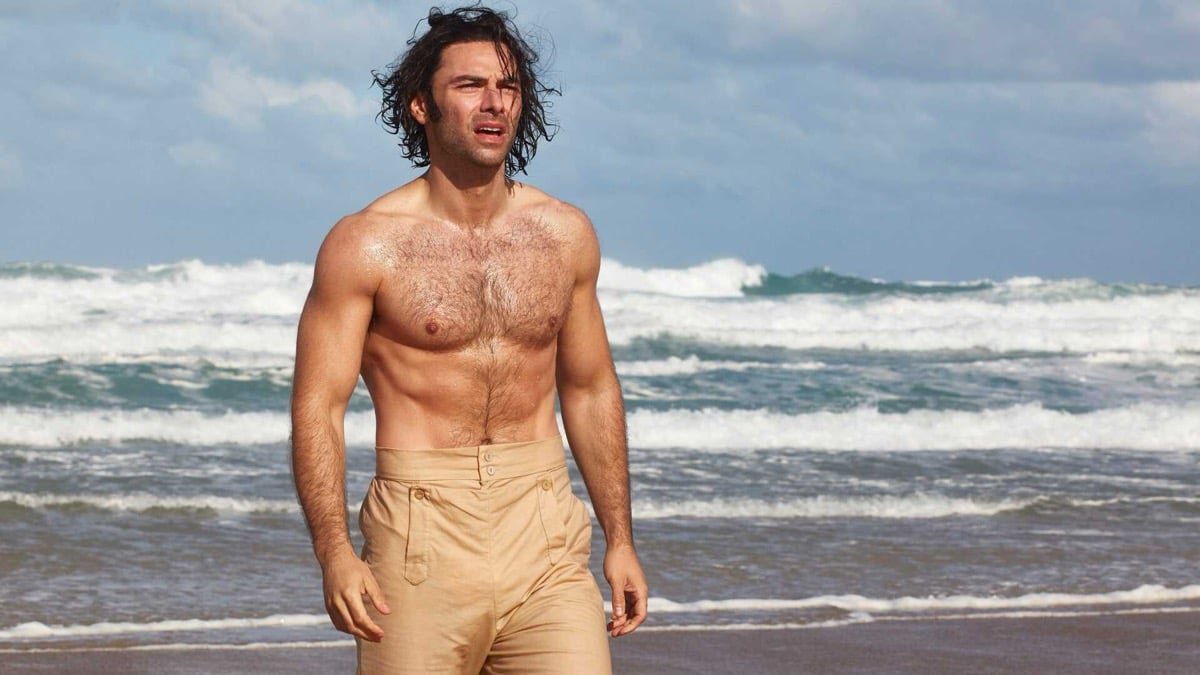 A shirtless man stands by the seaside in "Poldark" 