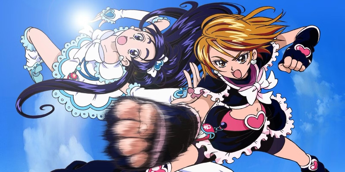 Two girls, dressed in black and white maid costumes, lead through the blue sky in "Pretty Cure" 