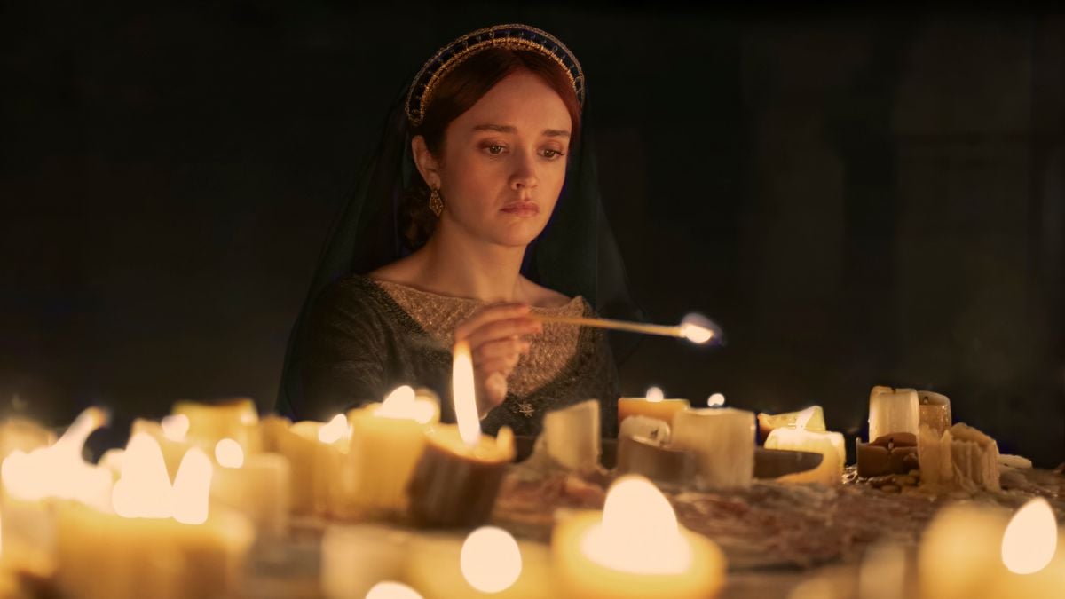 Olivia Cooke as Queen Alicent Hightower lighting candles at the sept in House of the Dragon season 2 episode 1