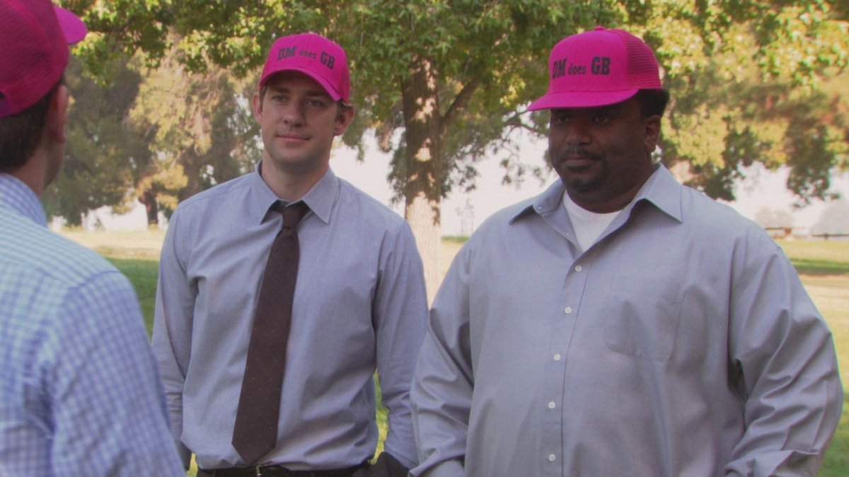 Jim and Daryl wearing bright pink "DM does GB" hats
