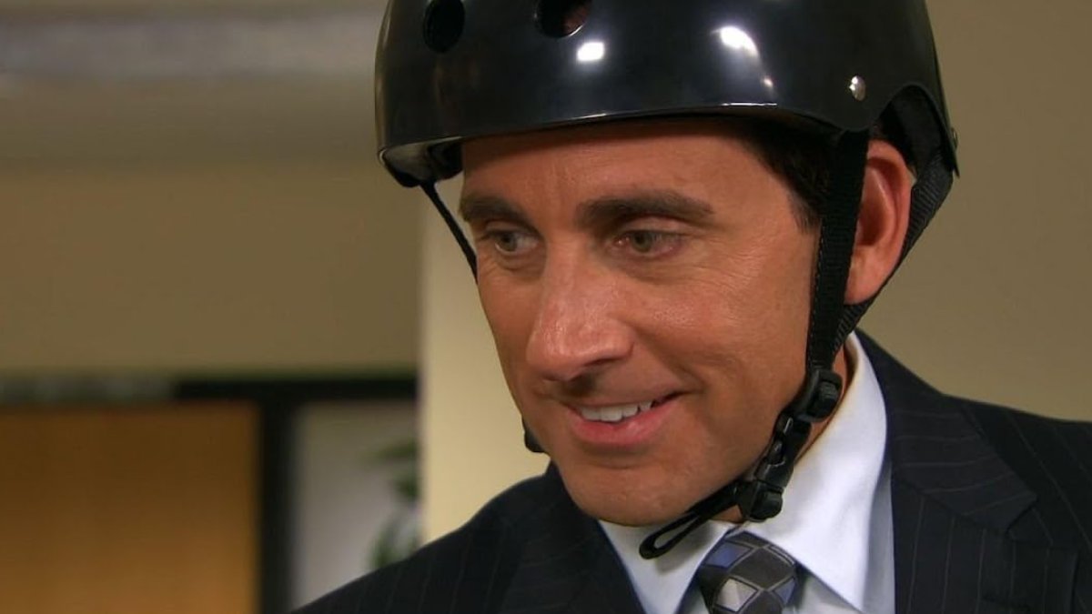 Michael Scott wearing a bike helmet