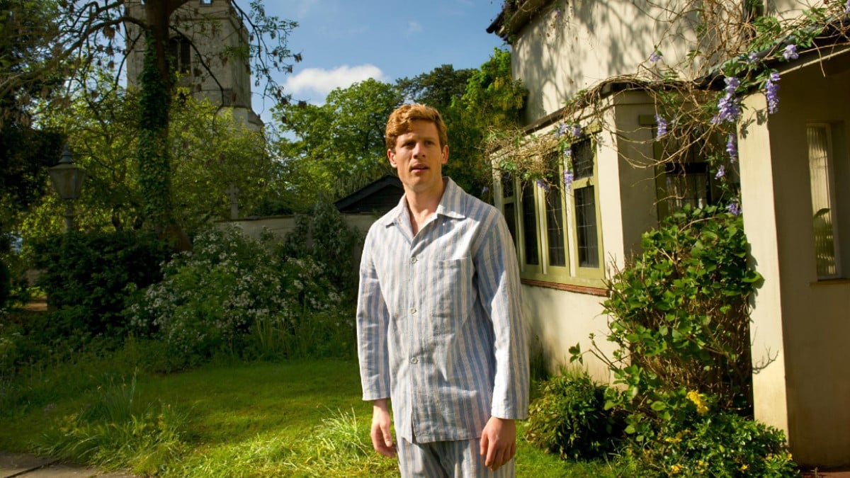 James Norton as Sidney Chambers, standing outside the vicarage in his pyjamas in Grantchester 