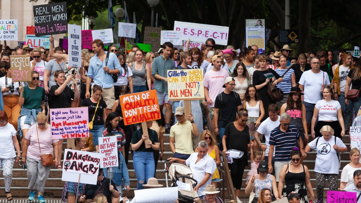 Women participate in the Women's Wave March to protest domestic violence in Australia