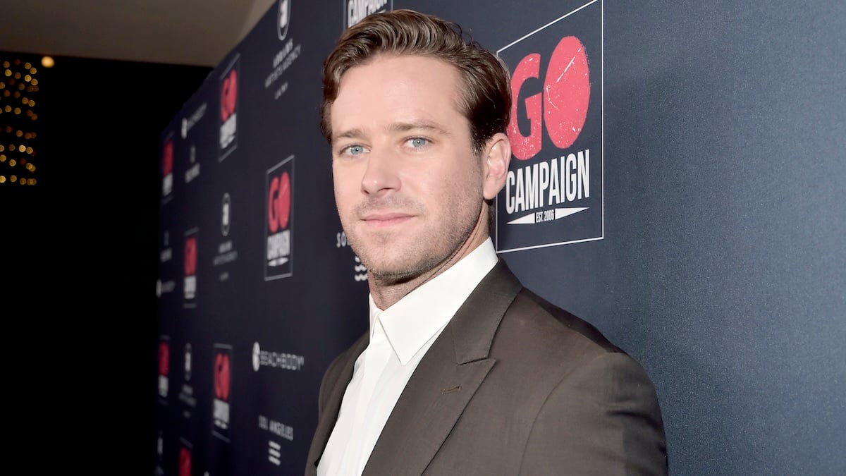 Armie Hammer looking at the camera on a red carpet