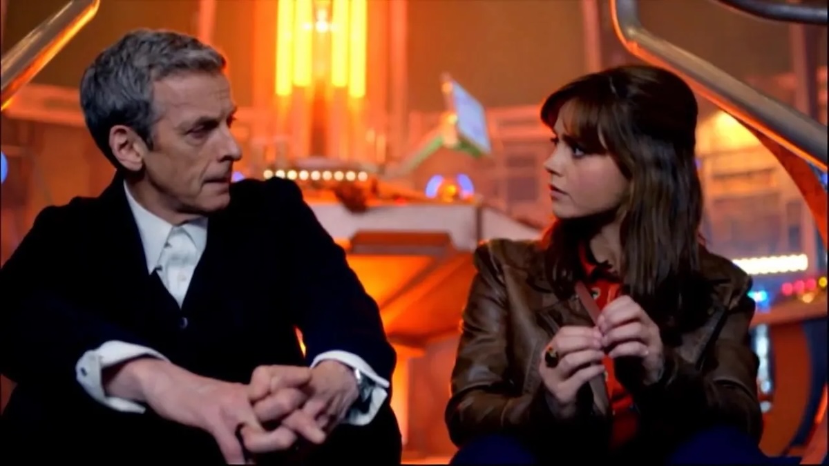 the doctor and clara sitting side by side and looking at each other