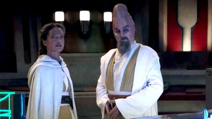 Master Ki-Adi-Mundi (R) stands around a conference table in 'The Acolyte'