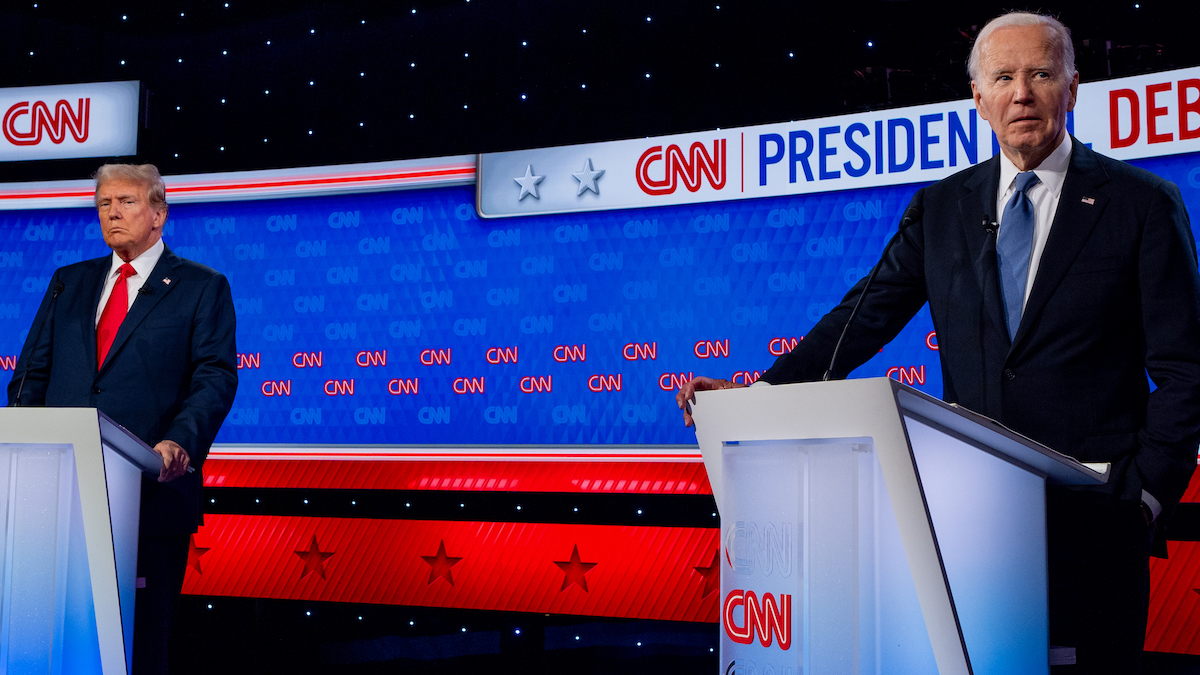 Donald Trump and Joe Biden stand at debate podiums