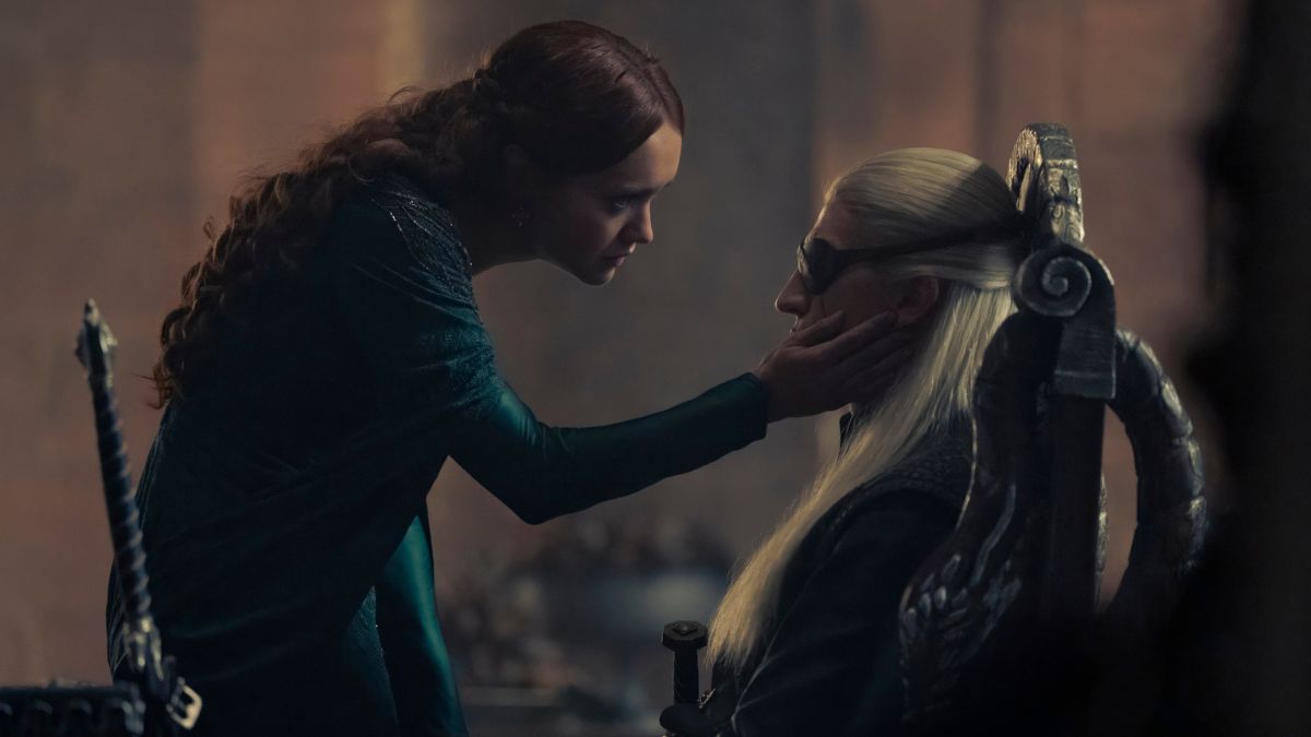 Olivia Cooke as Alicent Hightower touches Ewan Mitchell as Aemond Targaryen's cheek in House of the Dragon