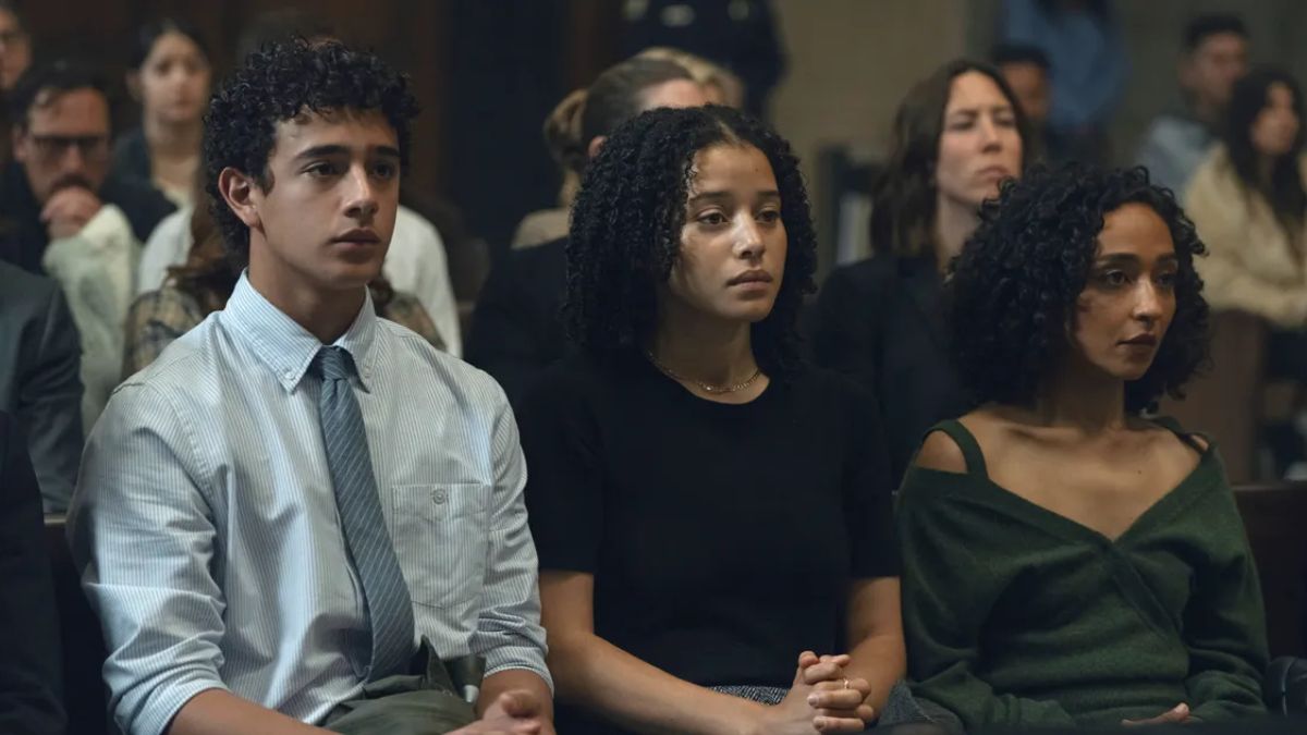 Barbara, Jaden, and Kyle Sabich seated in the courtroom in Presumed Innocent