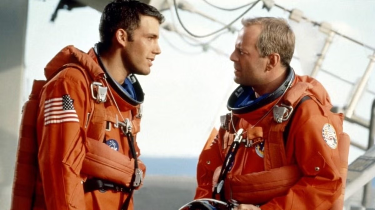 Ben Affleck and Bruce Willis talk in an Armageddon movie still