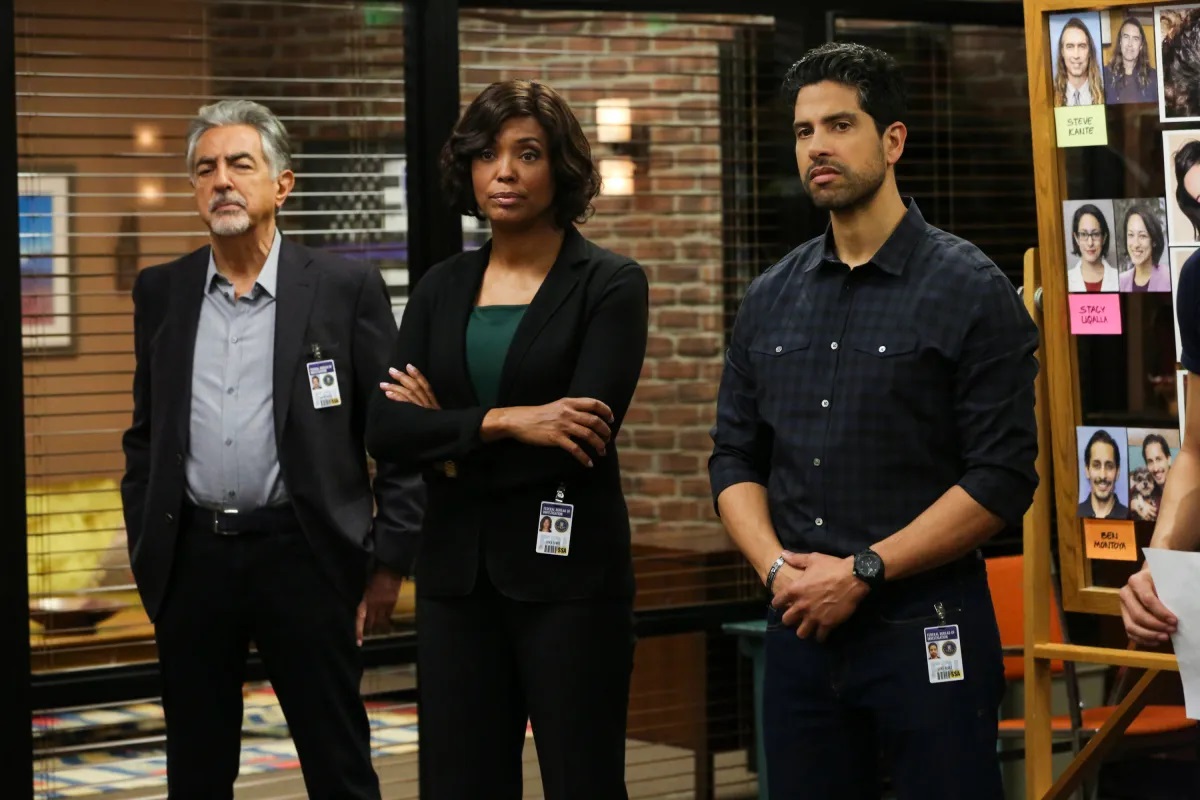 three agents of the BAU stand with their arms folded