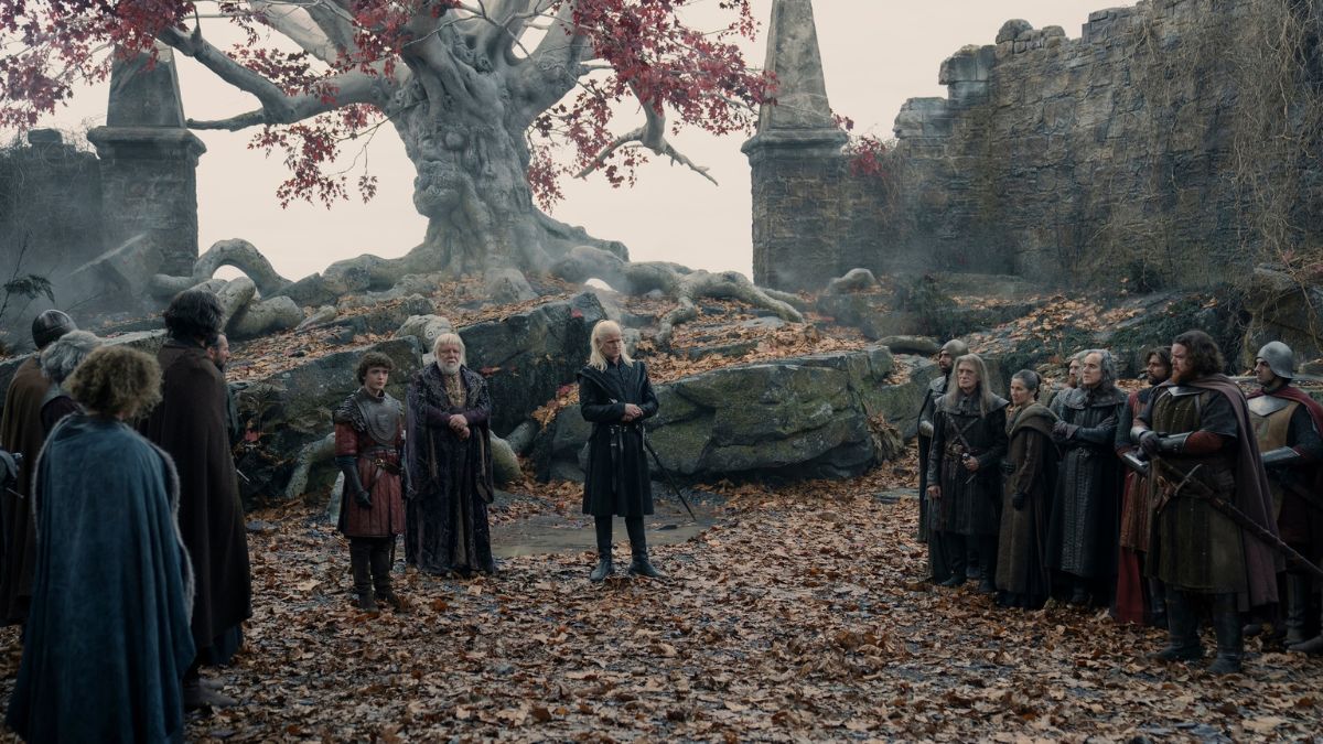 At the Godswood in Harrenhal, Daemon Targaryen, Oscar Tully, and Sir Simon Strong stand before the Riverlords of the Riverlands