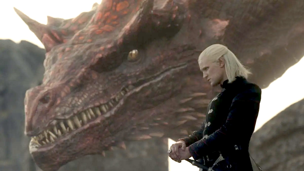 Matt Smith as Daemon Targaryen stands next to his dragon Caraxes in House of the Dragon