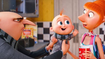 A suspicious Gru hands over his smiling son Gru Jr. to his wife Lucy in Despicable Me 4