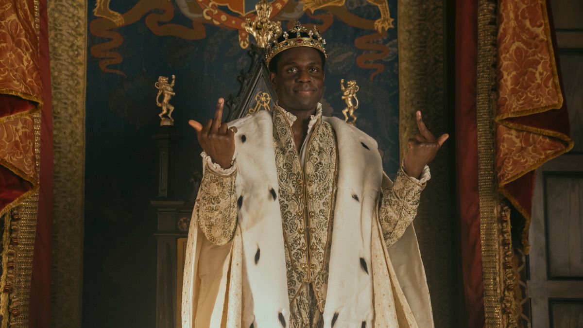 Jordan Peters as King Edward shows the finger to his court in My Lady Jane