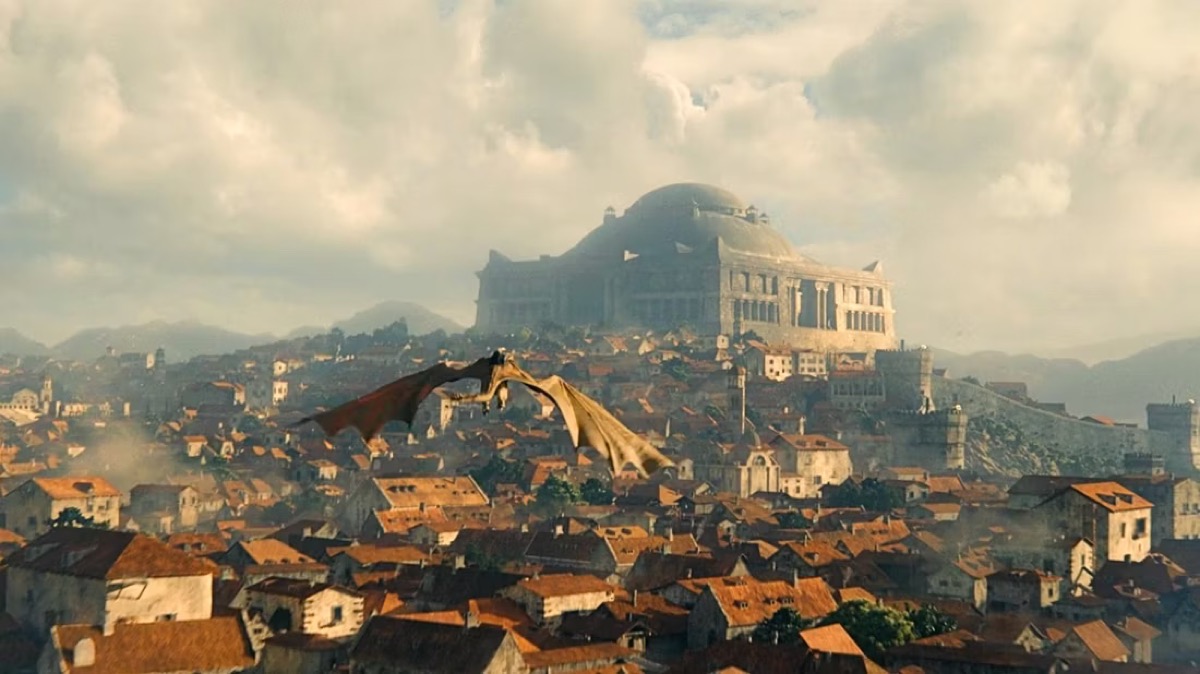 A dragon flying over King's Landing in HBO's House of the Dragon.