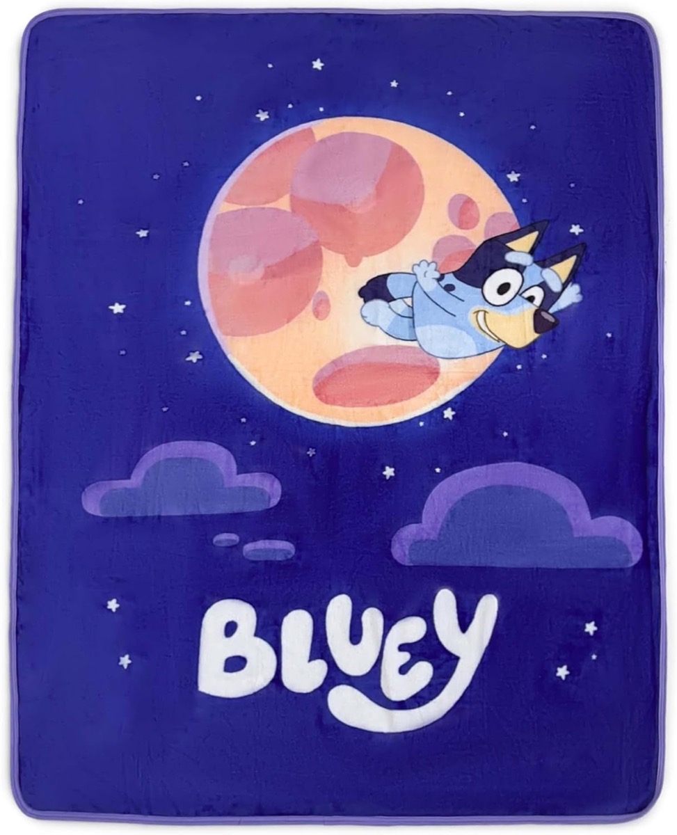 A throw blanket picturing Bluey flying across the moon