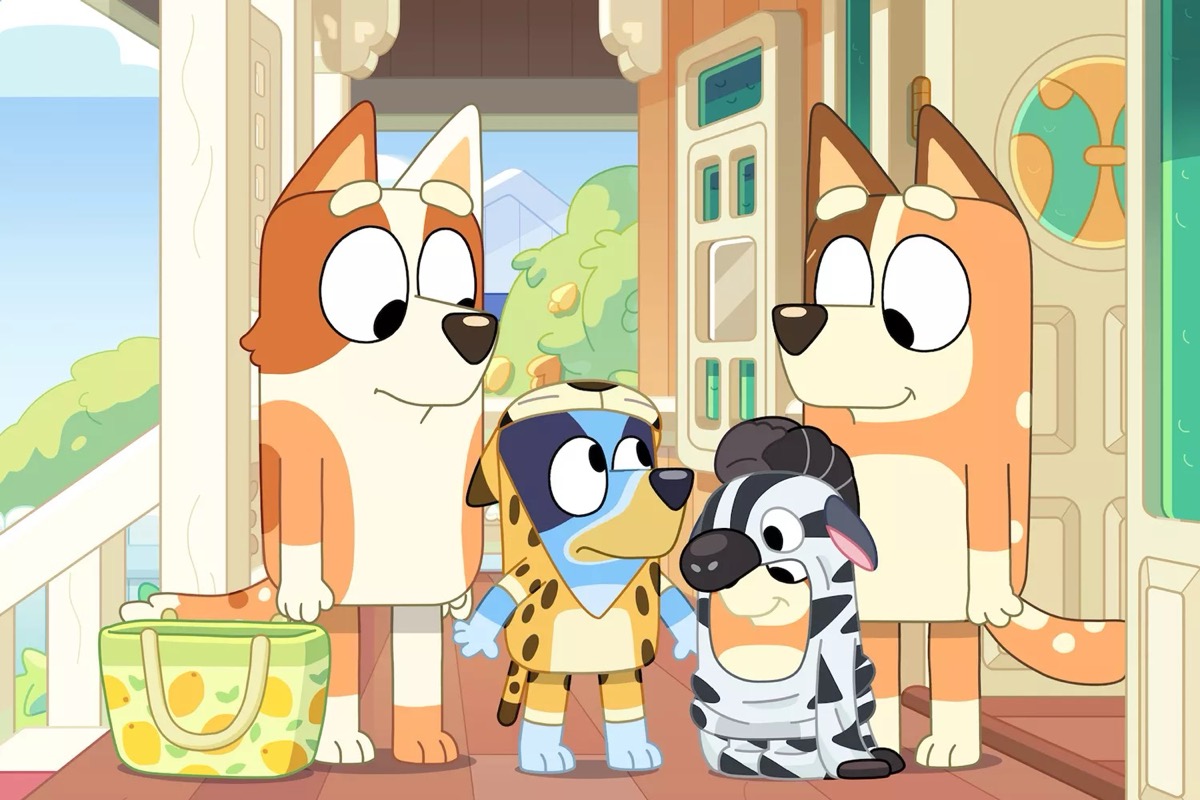 A family of dogs stands out on a front porch in "Bluey" 