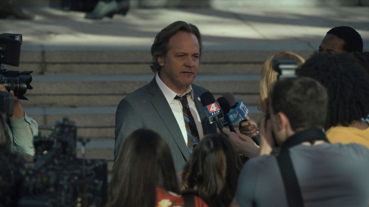 Peter Sarsgaard as Tommy Molto gives a media byte outside court in Presumed Innocent