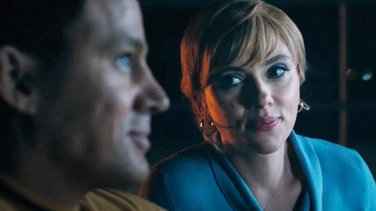 Scarlett Johansson as Kelly Jones gazes admiringly at Channing Tatum as Cole Davis who is smiling in Fly Me To The Moon