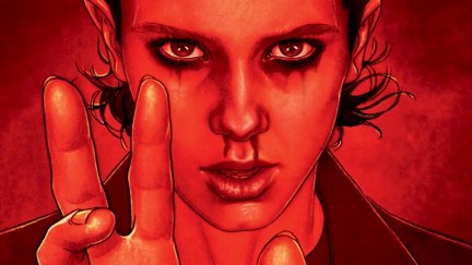 An image of Eleven from Stranger Things holding up her fingers with streaks of blood dripping from her nose on the cover of a comic book. The image is in red.