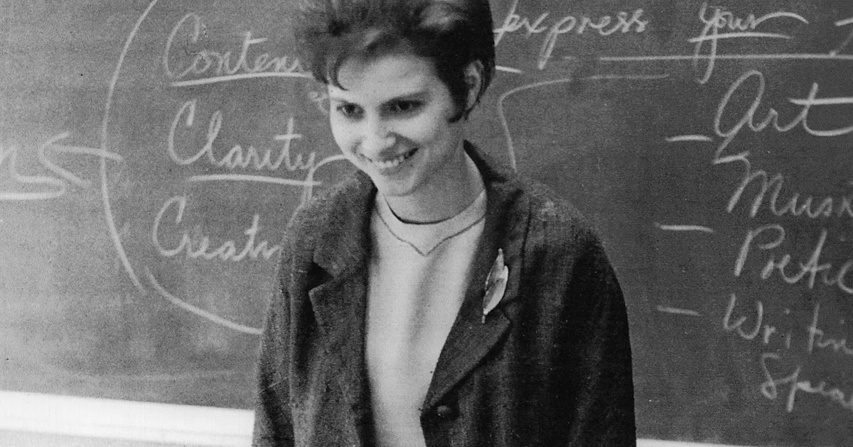 An image of a school teacher smiling from "The Keepers"