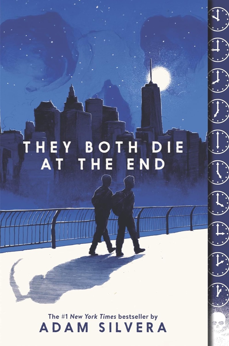 Cover art for "They Both Die At The End" showing two young men walking at night with the NYC skyline in the background