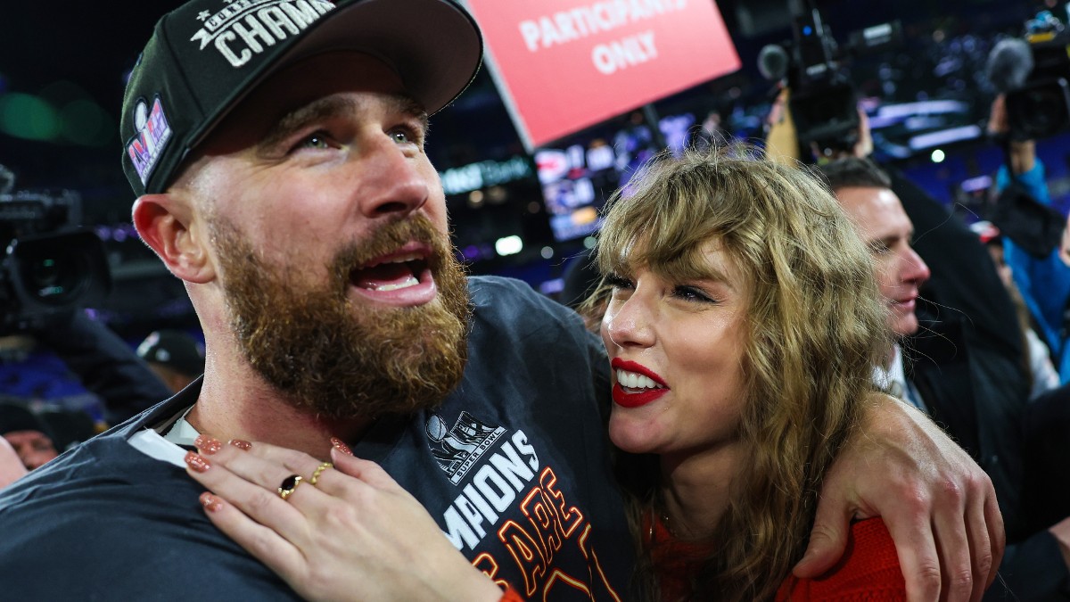 Travis Kelce and Taylor Swift celebrate after a football game