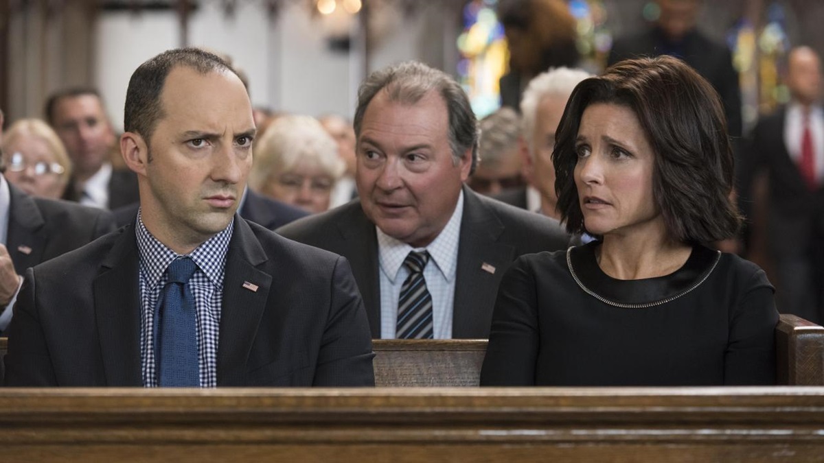 Mike sits between Gary and Selina in church