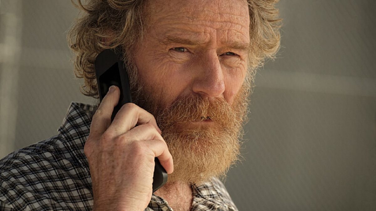 A bearded man looks perturbed on a phonecall in "Your Honor"