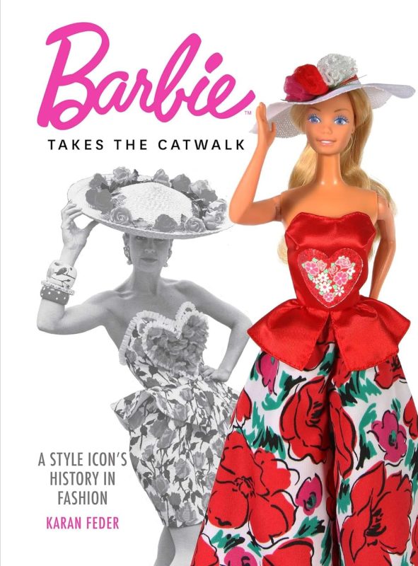 Cover of Barbie Takes the Catwalk: A Style Icon's History in Fashion; a white book with the Barbie logo in pink at the top and a colour photograph of a blonde Barbie in a red dress and matching hat, with a grey scale shadow image at an angle behind her.