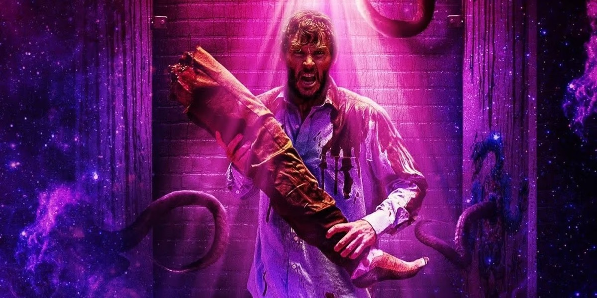 A freaked out man holds a severed leg while bathed in purple light in "Glorious"