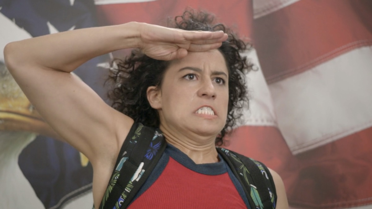 Ilana saluting the flag on Broad City