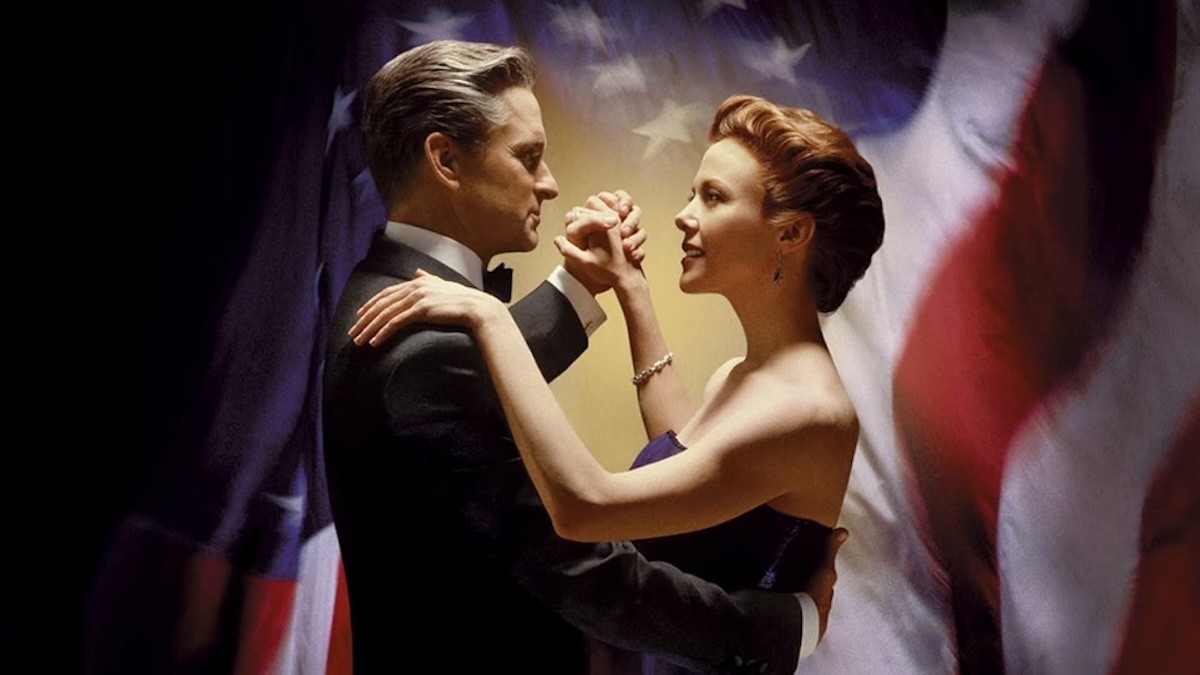 The president and his wife dancing together in front of an American flag in The American President