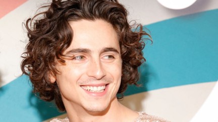 Timothee Chalamet poses for Wonka press photos.