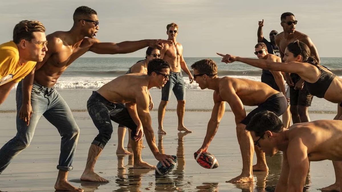 the cast of top gun maverick on the beach shirtless together