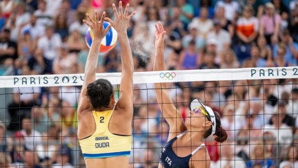 Eduarda Santos Lisboa and Marta Menegatti compete in a women's beach volleyball match during the 2024 Olympics