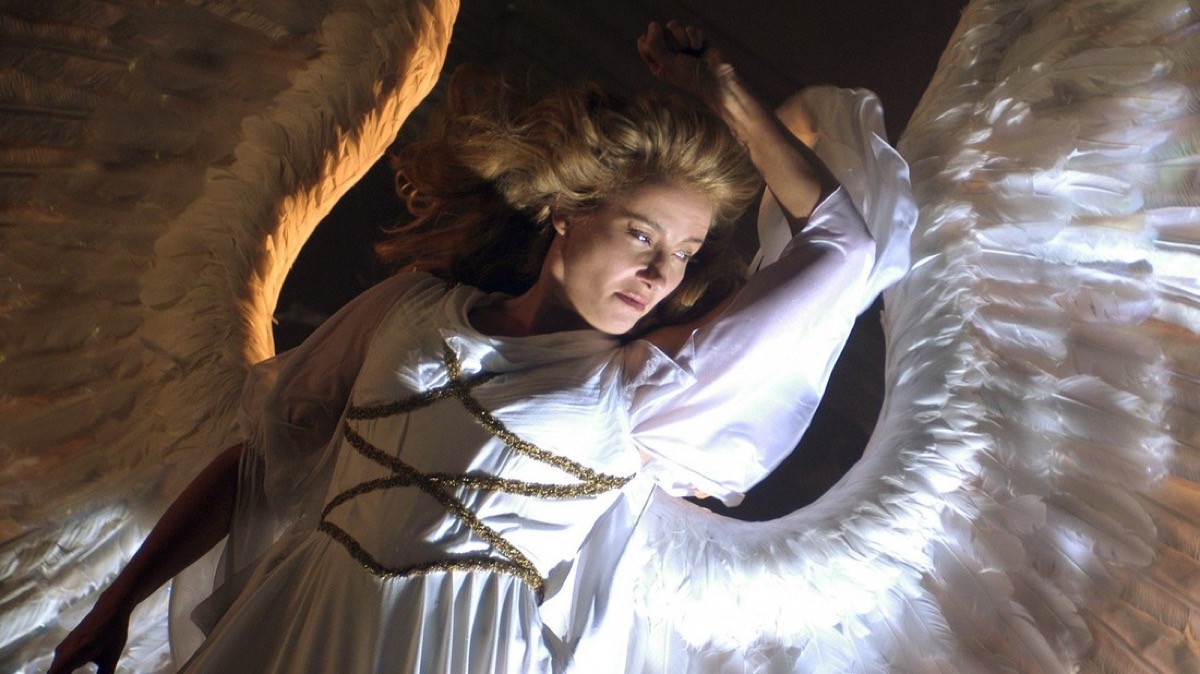 An angel floats above in "Angels In America"