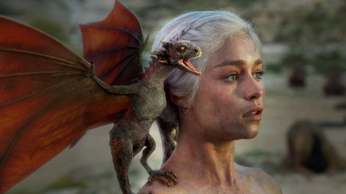 Daenerys Targaryen with one of her baby dragons in Game of Thrones