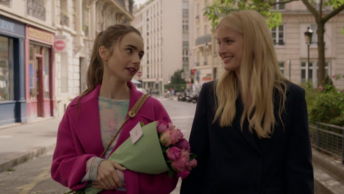 Emily and Camille chat on the street