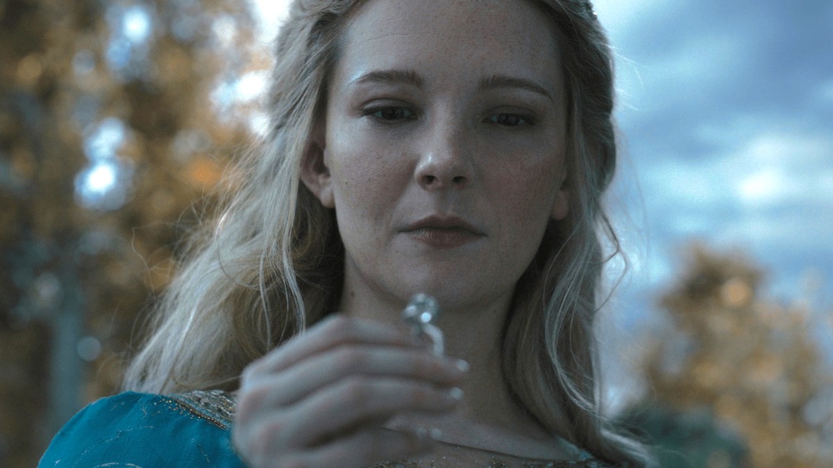 Morfydd Clark as Galadriel, looking intently at a ring.