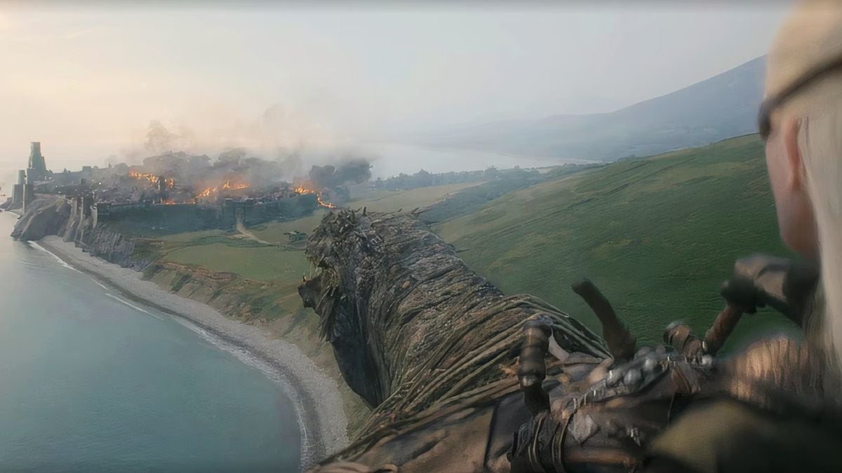 Aemond Targaryen and his dragon Vhagar look over the castle of Sharp Point which they have just burned