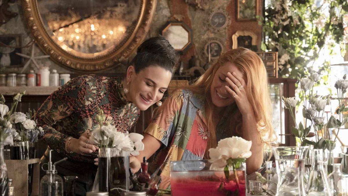 Jenny Slate as Allysa and Blake Lively as Lily laugh in a flower shop in It Ends With Us