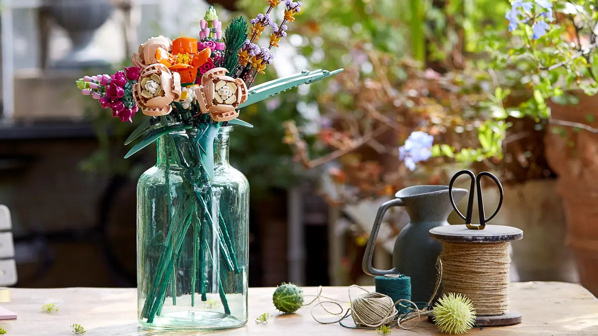 An image of LEGO's Flower Bouquet set, built and presented in a blue vase.