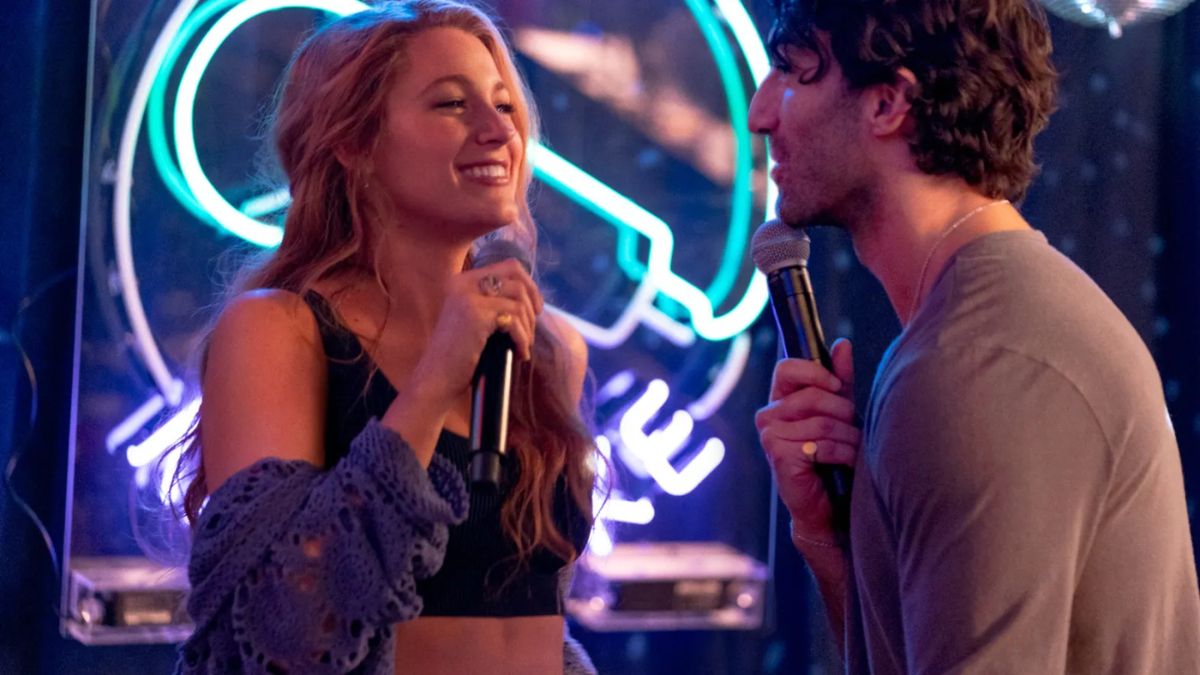 Blake Lively as Lily Bloom and Justin Baldoni as Ryle Kincaid sing karaoke in a scene in It Ends With Us