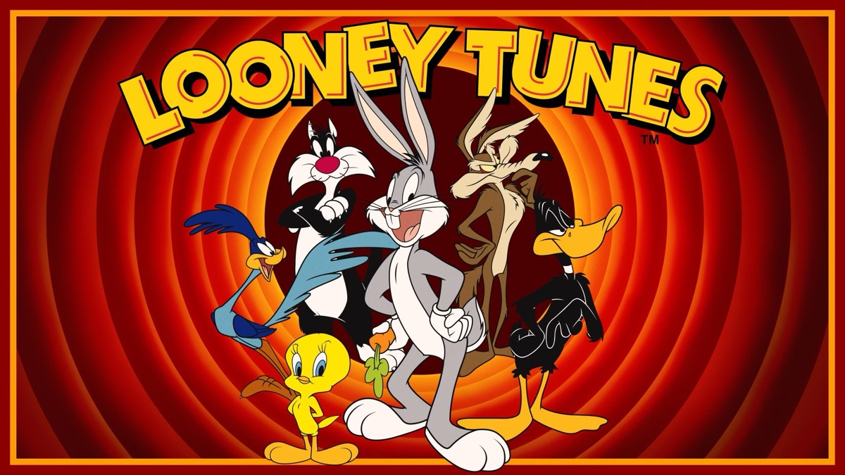 The cast of Looney Tunes standing in front of the trademark circles background