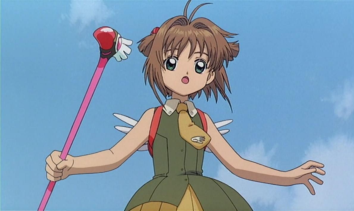 Sakura Minamoto from 'Cardcaptor Sakura' wielding a magical staff while floating mid air