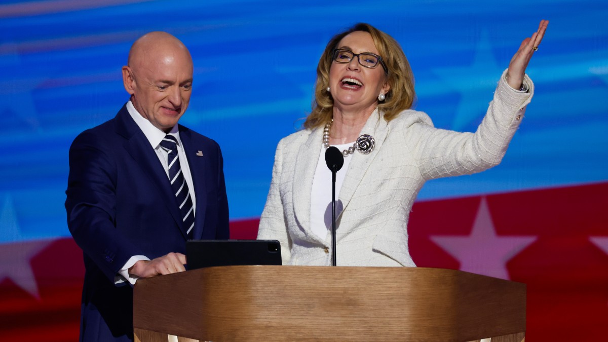 Gabby Giffords and her husband Mark Kelly speak at the DNC