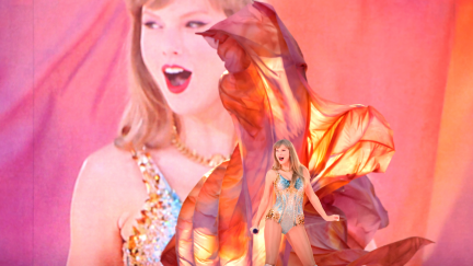 Taylor Swift performs onstage in front of a huge video projection of herself