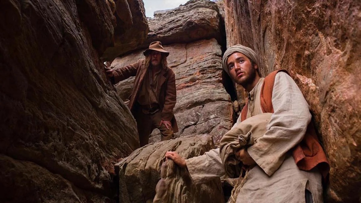 Two men climb down a canyon in "The Furnace"